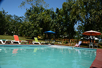 Outdoor swimming pool filled with river water.